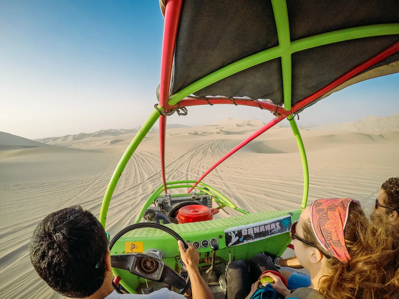 Huacachina oasis surrounded by desert dunes