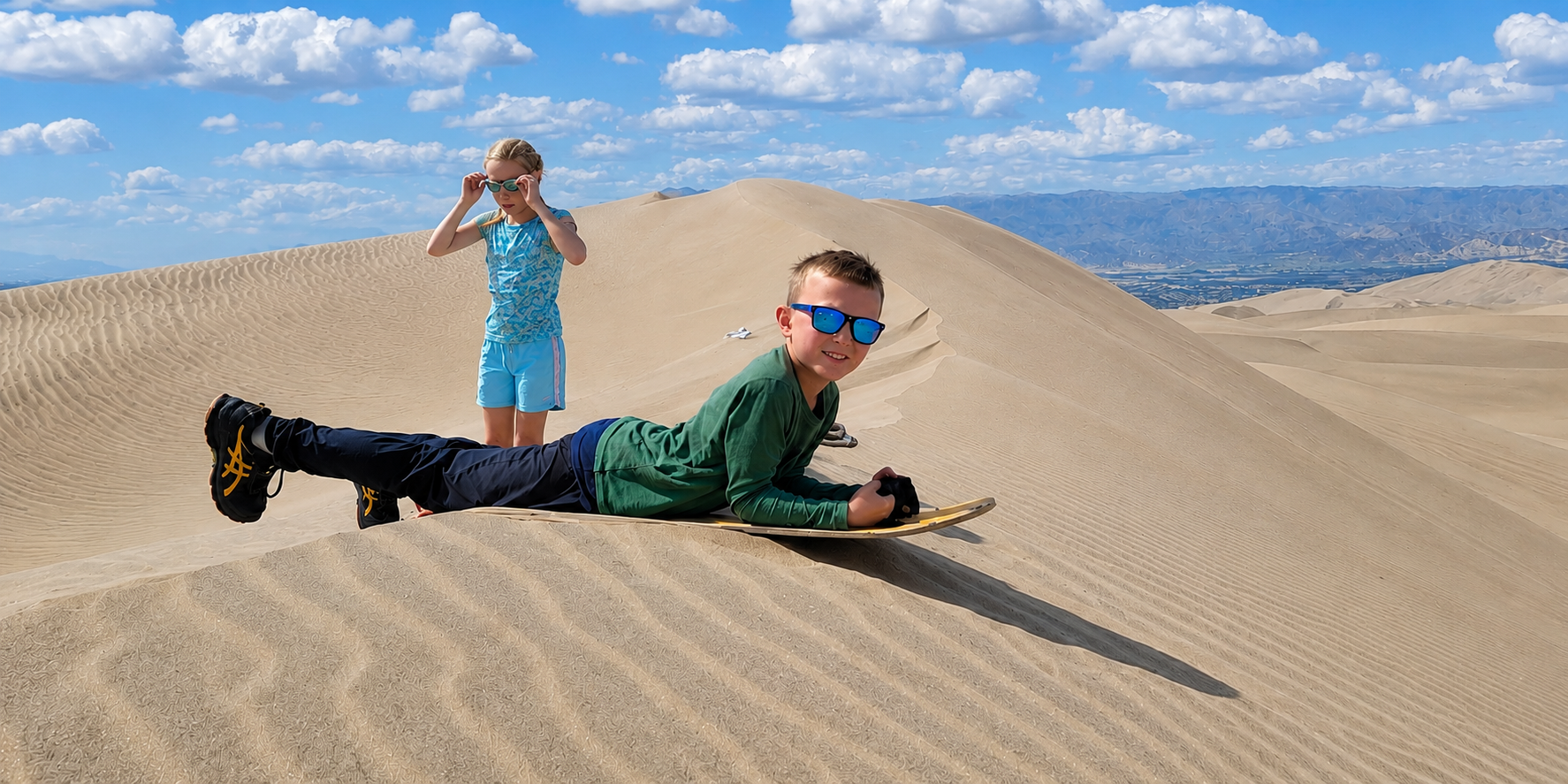 Children enjoying the dunes near Huacachina