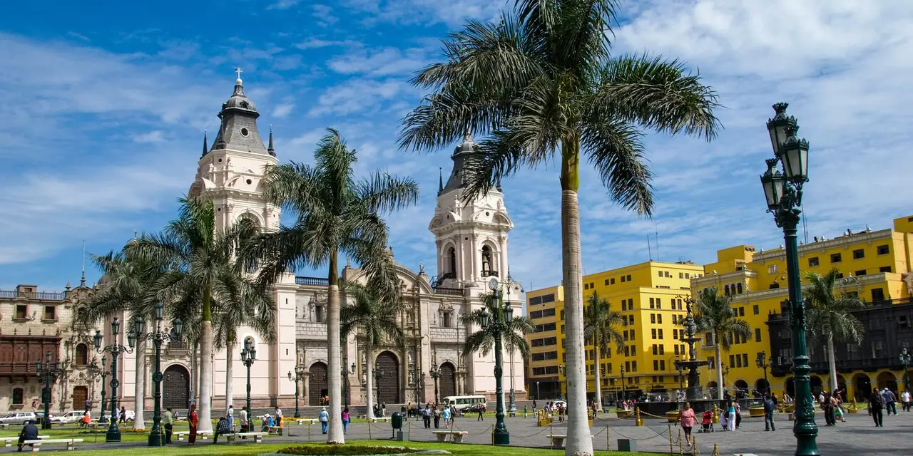 Cathedral towers and palms in Lima's historic center