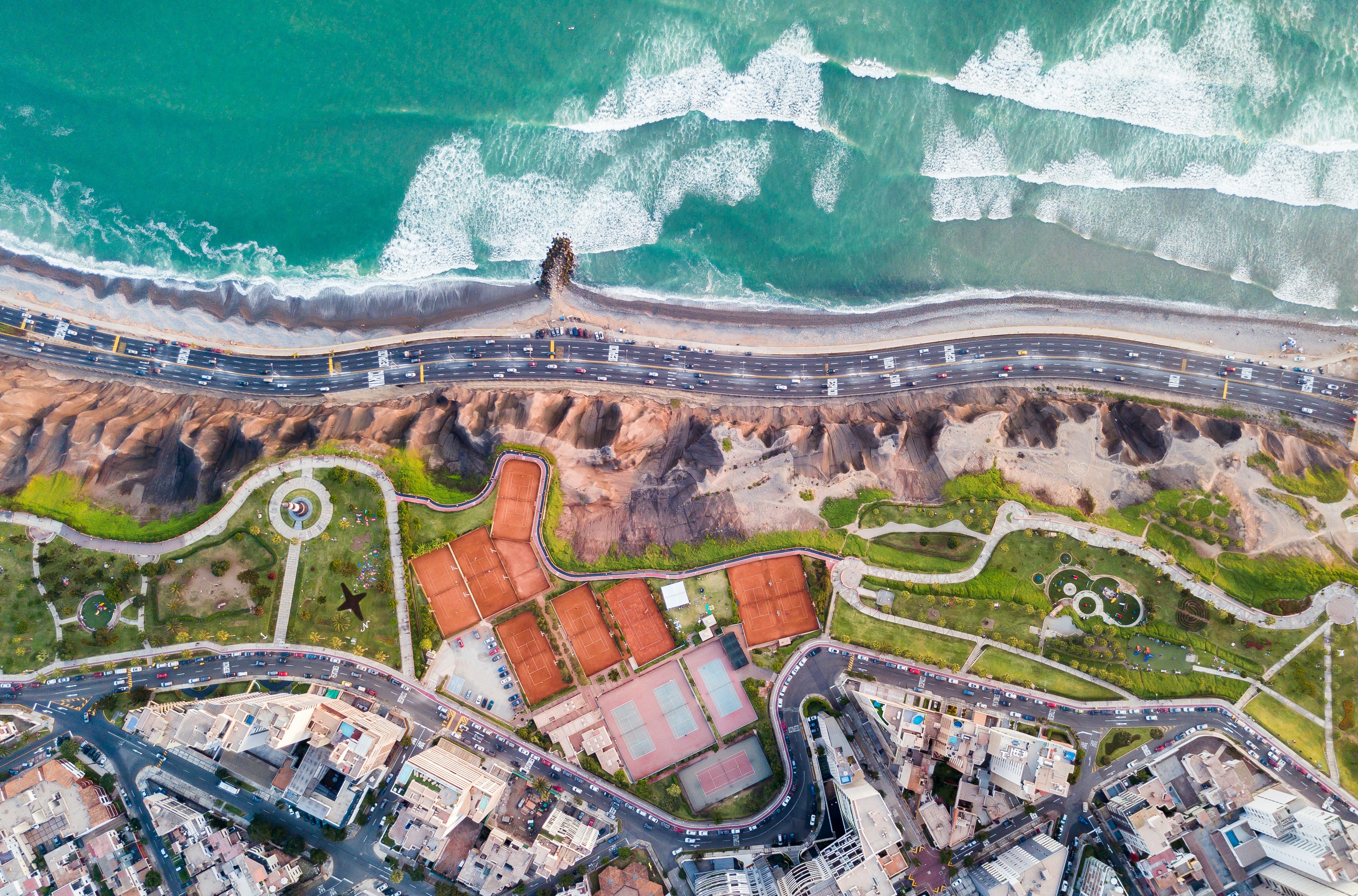Aerial view of Lima's Pacific cliffs, parks and coastal road