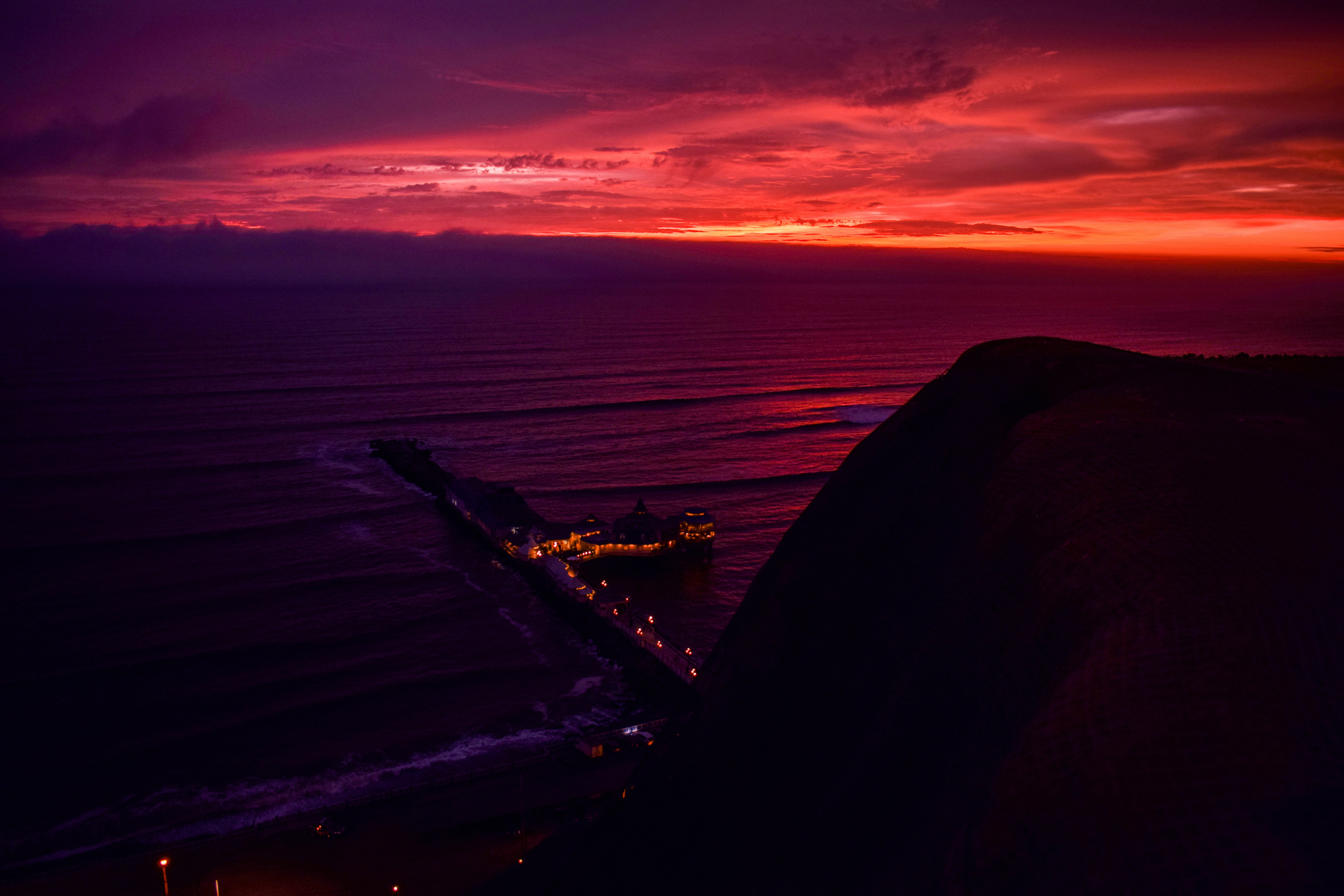 Dramatic sunset over Lima's Pacific coastline