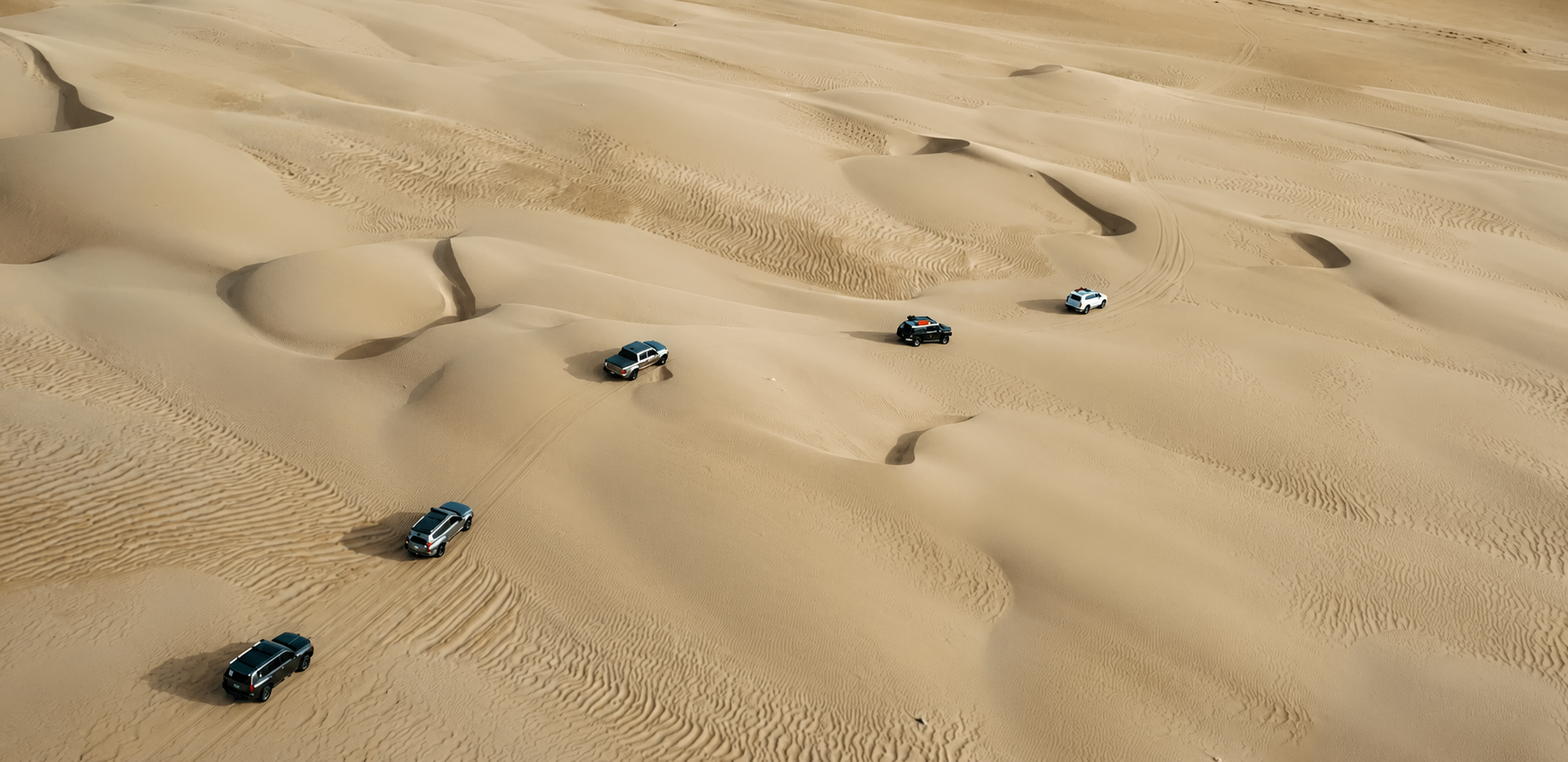 4x4 vehicles crossing the Paracas desert dunes